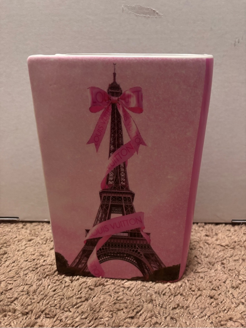 Louis Vuitton pink Eiffel Tower book shaped vase with pink ribbon